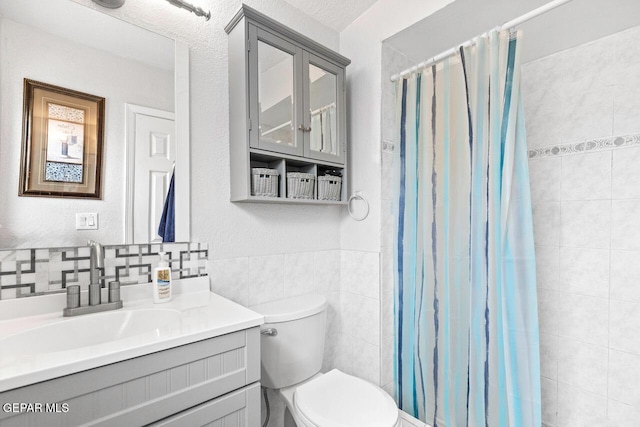 10636 Palomino St, El Paso, TX 79924 - bathroom featuring tile walls, vanity, and a shower with shower curtain