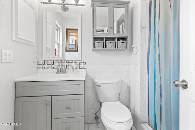 10636 Palomino St, El Paso, TX 79924 - bathroom with tile walls, vanity, a shower with shower curtain, and tile patterned flooring