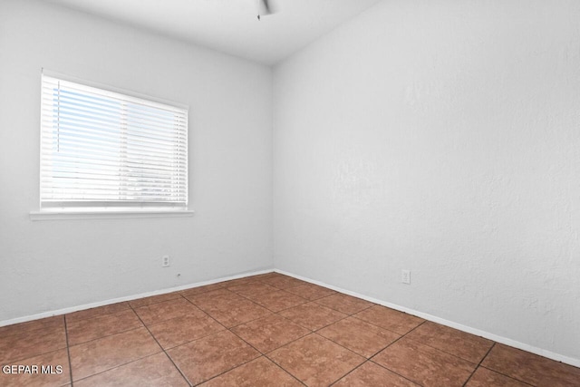 10636 Palomino St, El Paso, TX 79924 - empty room with ceiling fan and tile patterned floors