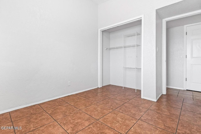 10636 Palomino St, El Paso, TX 79924 - unfurnished bedroom with a closet and tile patterned flooring