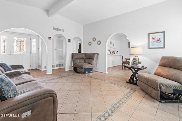 10636 Palomino St, El Paso, TX 79924 - living room with light tile patterned floors and arched walkways