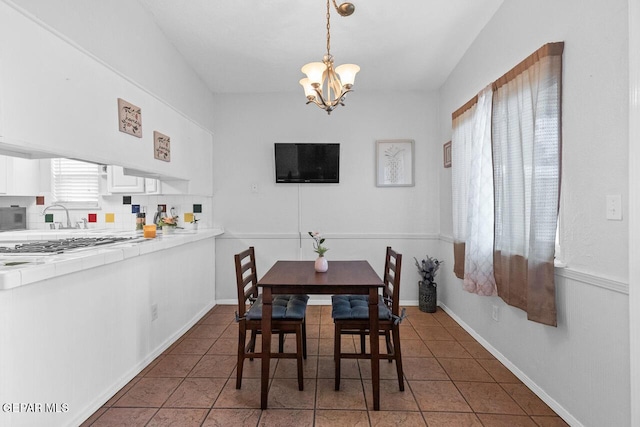 10636 Palomino St, El Paso, TX 79924 - dining room featuring a chandelier and tile patterned flooring