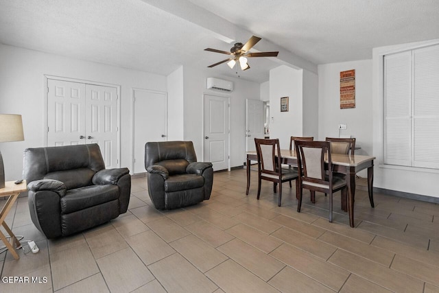 10636 Palomino St, El Paso, TX 79924 - living room featuring ceiling fan, a wall mounted AC, and beamed ceiling