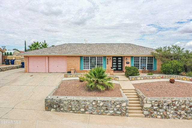 10705 Vista Alegre Dr, El Paso, TX 79935 - ranch-style house with brick siding, driveway, a garage, and roof with shingles