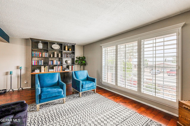 10705 Vista Alegre Dr, El Paso, TX 79935 - living area with wood finished floors and a textured ceiling