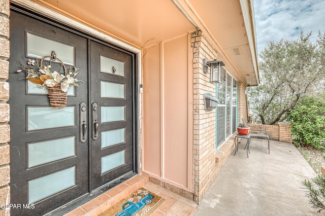 10705 Vista Alegre Dr, El Paso, TX 79935 - doorway to property with french doors and brick siding