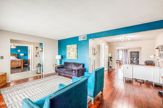 10705 Vista Alegre Dr, El Paso, TX 79935 - living area with a textured ceiling, hardwood / wood-style floors, and a chandelier