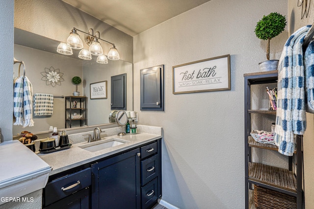 10705 Vista Alegre Dr, El Paso, TX 79935 - bathroom with vanity and a textured wall