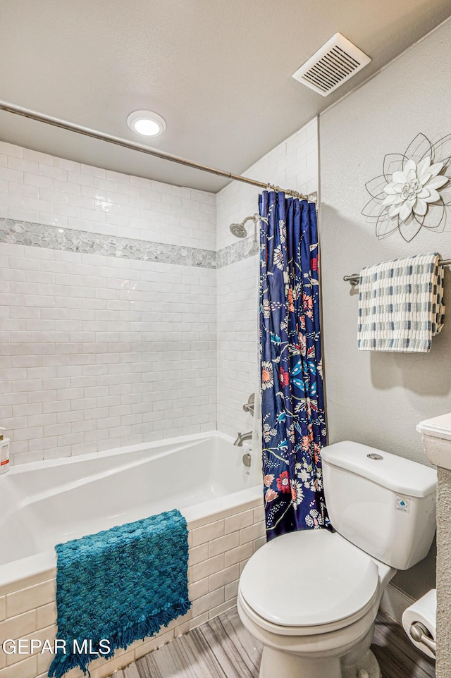 10705 Vista Alegre Dr, El Paso, TX 79935 - bathroom featuring tiled shower / bath combo and recessed lighting