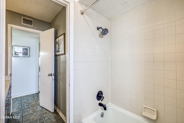 10705 Vista Alegre Dr, El Paso, TX 79935 - bathroom with a textured ceiling and bathtub / shower combination