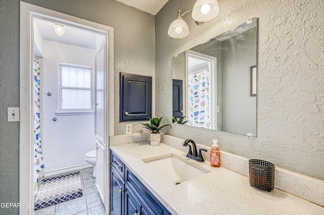 10705 Vista Alegre Dr, El Paso, TX 79935 - full bath with a textured wall, vanity, tile patterned floors, and curtained shower