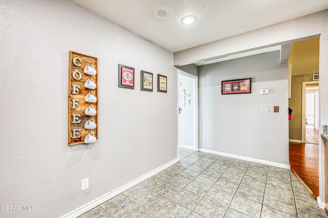 10705 Vista Alegre Dr, El Paso, TX 79935 - hallway with baseboards and light tile patterned floors