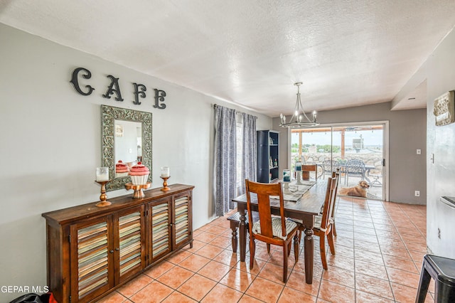 10705 Vista Alegre Dr, El Paso, TX 79935 - dining room featuring a chandelier, light tile patterned flooring, and a textured ceiling