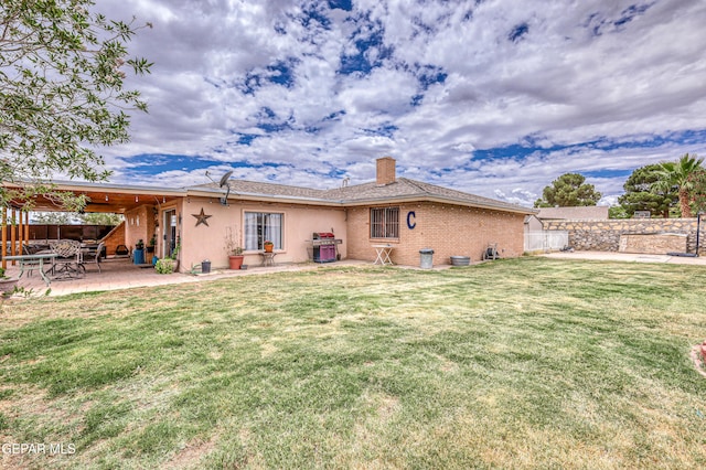 10705 Vista Alegre Dr, El Paso, TX 79935 - rear view of property featuring a fenced backyard, brick siding, a chimney, and a patio area