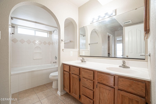 3340 Tierra Yvette Ln, El Paso, TX 79938 - full bathroom with double vanity, tile patterned floors, and tiled shower / bath combo