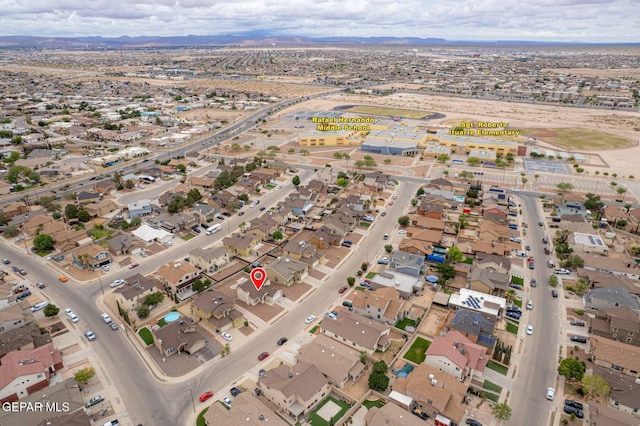 3340 Tierra Yvette Ln, El Paso, TX 79938 - aerial view of property's location featuring a mountainous background and nearby suburban area