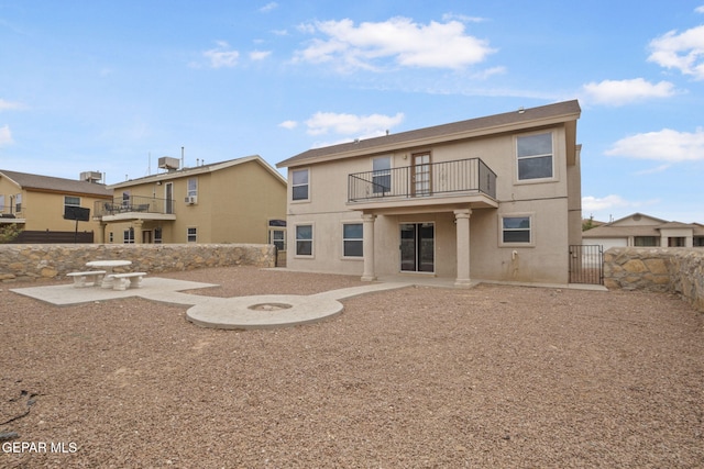 3340 Tierra Yvette Ln, El Paso, TX 79938 - back of property featuring a balcony, stucco siding, a patio, and a gate