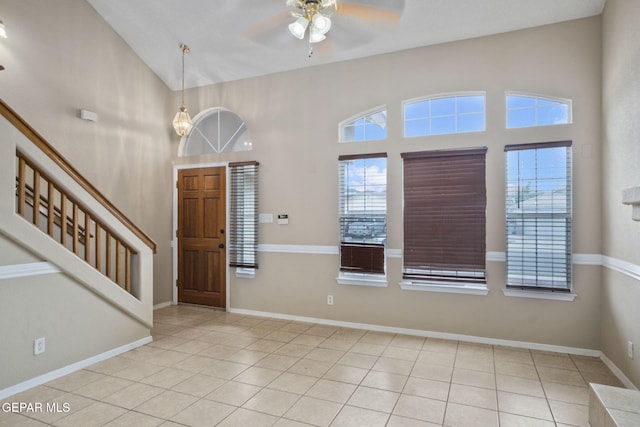 3340 Tierra Yvette Ln, El Paso, TX 79938 - entrance foyer featuring ceiling fan, healthy amount of natural light, stairway, tile patterned floors, and high vaulted ceiling