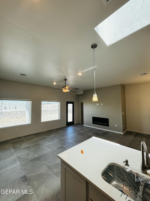 13066 Emerald Isle St, El Paso, TX 79928 - kitchen with recessed lighting, pendant lighting, light countertops, ceiling fan, and open floor plan