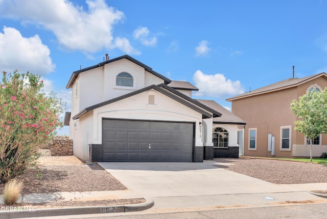 6913 Jericho Tree Dr, El Paso, TX 79934 - traditional home with concrete driveway, an attached garage, and stucco siding