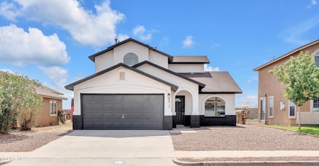 6913 Jericho Tree Dr, El Paso, TX 79934 - view of front of home featuring concrete driveway, an attached garage, stucco siding, and roof with shingles