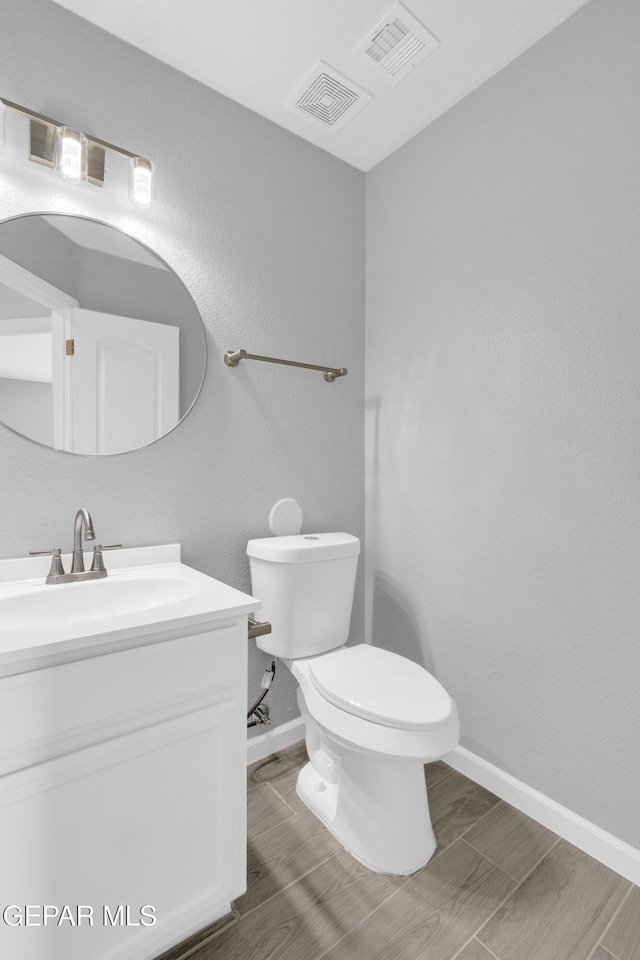 6913 Jericho Tree Dr, El Paso, TX 79934 - bathroom with vanity and wood finished floors