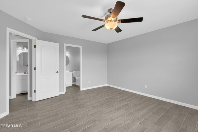 6913 Jericho Tree Dr, El Paso, TX 79934 - unfurnished bedroom featuring wood finished floors, ensuite bath, and a ceiling fan