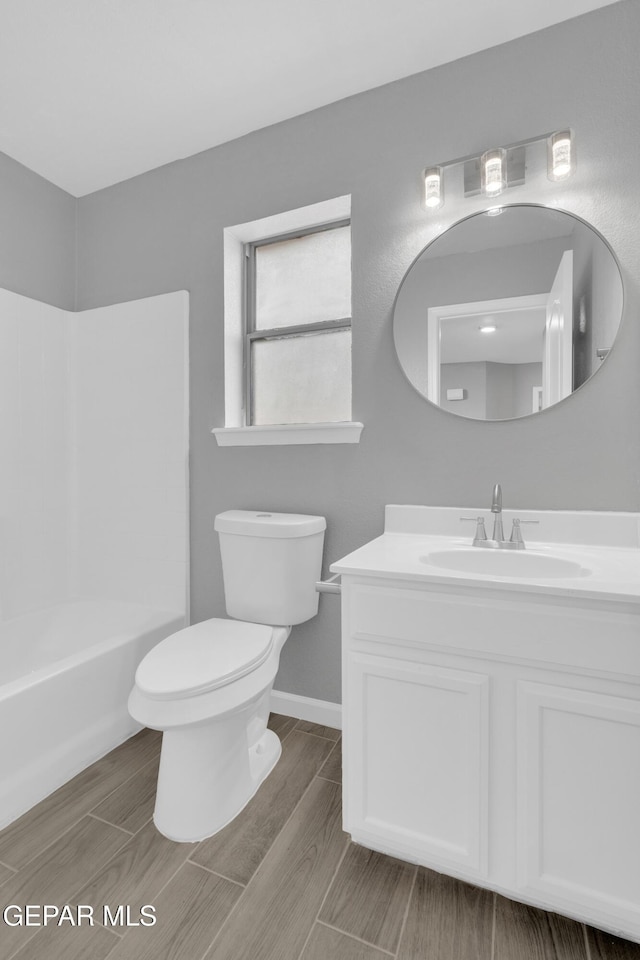 6913 Jericho Tree Dr, El Paso, TX 79934 - full bathroom with vanity, wood finish floors, and  shower combination
