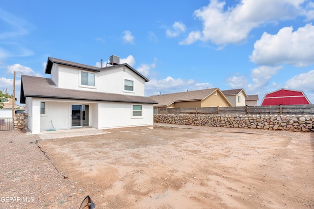 6913 Jericho Tree Dr, El Paso, TX 79934 - rear view of property featuring stucco siding and a fenced backyard