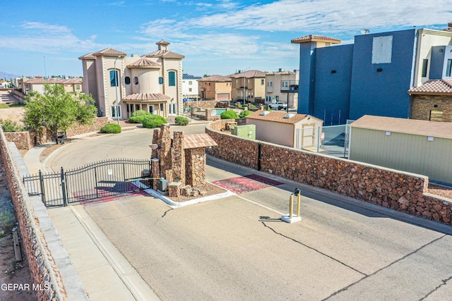 12257 Gaudi Way, El Paso, TX 79938 - view of home's community with a residential view and a gate