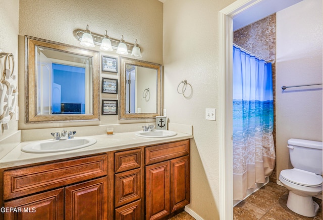 12257 Gaudi Way, El Paso, TX 79938 - bathroom featuring double vanity, curtained shower, and a textured wall