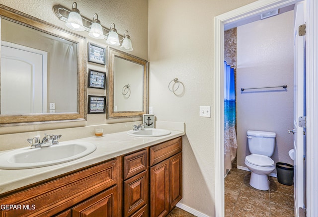 12257 Gaudi Way, El Paso, TX 79938 - bathroom featuring a textured wall, double vanity, and curtained shower