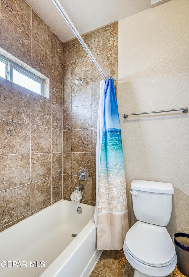 12257 Gaudi Way, El Paso, TX 79938 - full bathroom featuring shower / bath combo and a textured wall