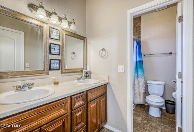 12257 Gaudi Way, El Paso, TX 79938 - bathroom with double vanity, a textured wall, and curtained shower