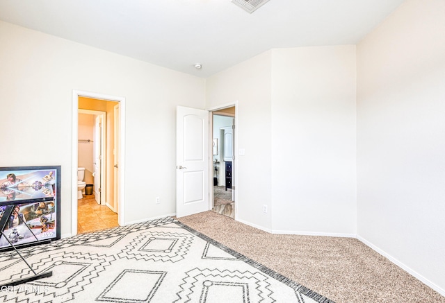 12257 Gaudi Way, El Paso, TX 79938 - unfurnished bedroom with light carpet and ensuite bath