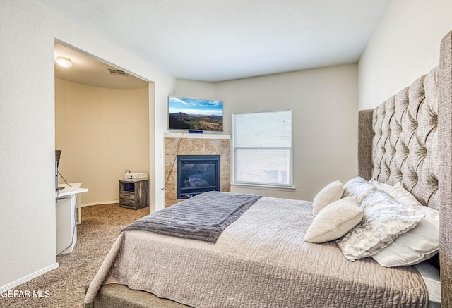 12257 Gaudi Way, El Paso, TX 79938 - bedroom featuring carpet flooring and a fireplace