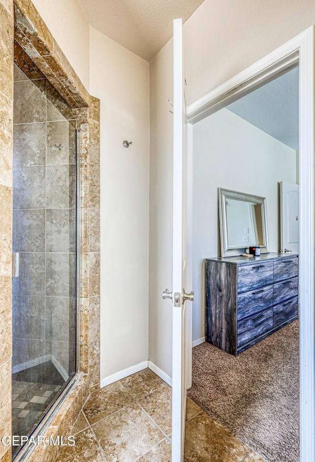 12257 Gaudi Way, El Paso, TX 79938 - full bathroom with a shower stall, tile patterned floors, and a textured ceiling