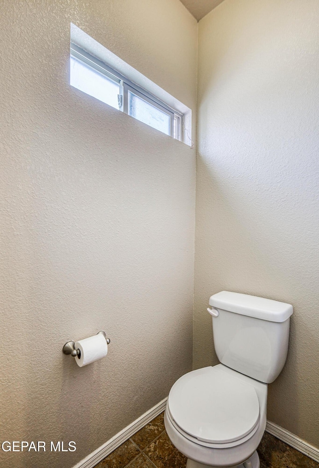 12257 Gaudi Way, El Paso, TX 79938 - bathroom with toilet and baseboards