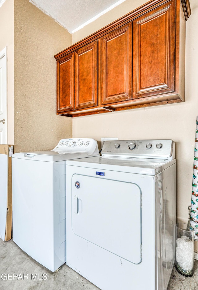 12257 Gaudi Way, El Paso, TX 79938 - laundry area featuring washer and dryer and cabinet space