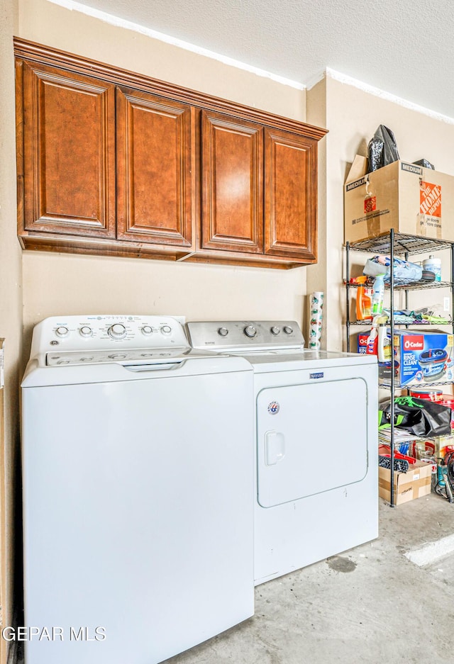 12257 Gaudi Way, El Paso, TX 79938 - washroom with washing machine and dryer, cabinet space, and a textured ceiling