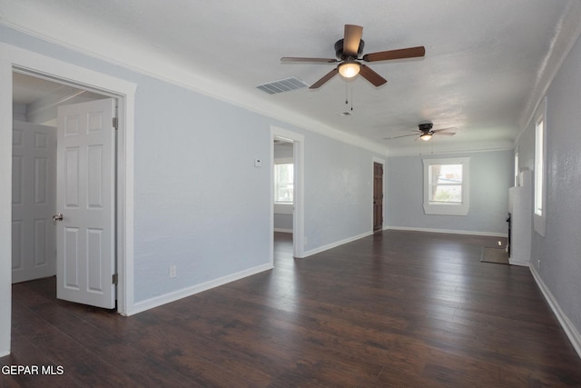 3411 Memphis Ave, El Paso, TX 79930 - empty room featuring a ceiling fan, dark wood finished floors, and crown molding