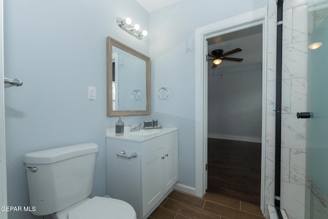 3411 Memphis Ave, El Paso, TX 79930 - bathroom featuring a ceiling fan, vanity, wood tiled floors, and a marble finish shower