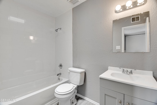 10712 Georgetown St, El Paso, TX 79924 - full bath featuring vanity, washtub / shower combination, and a textured wall