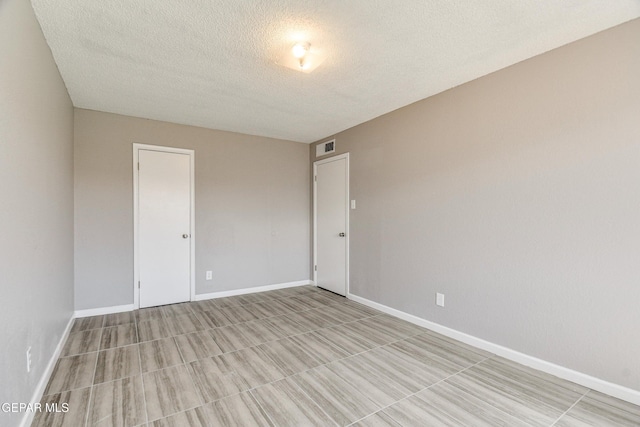 10712 Georgetown St, El Paso, TX 79924 - unfurnished room featuring a textured ceiling and baseboards
