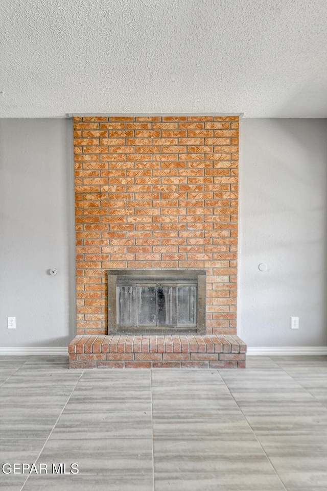 10712 Georgetown St, El Paso, TX 79924 - detailed view of a fireplace and a textured ceiling