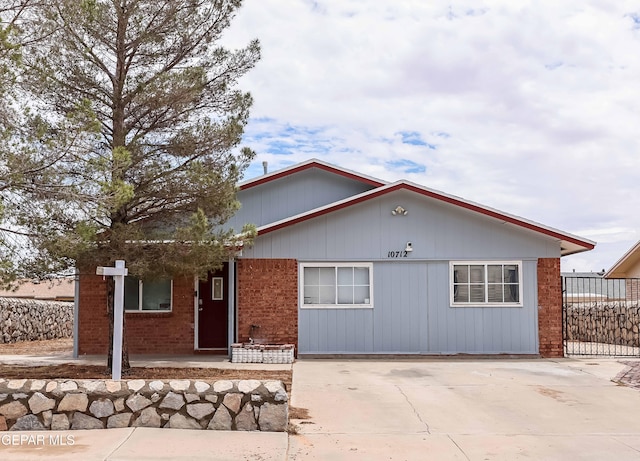 10712 Georgetown St, El Paso, TX 79924 - view of front of house with brick siding and concrete driveway
