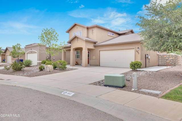 2937 Pino Triste Dr, El Paso, TX 79938 - view of front of house with stucco siding, concrete driveway, and an attached garage