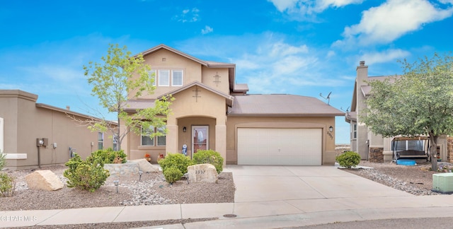 2937 Pino Triste Dr, El Paso, TX 79938 - mediterranean / spanish house featuring stucco siding, a garage, and concrete driveway