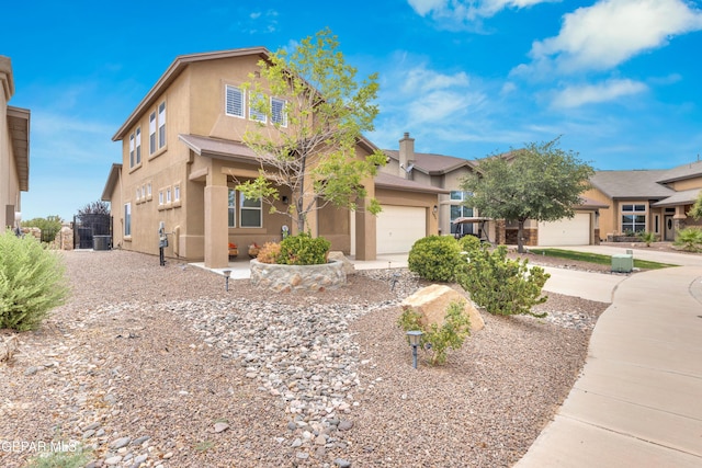 2937 Pino Triste Dr, El Paso, TX 79938 - view of front of property featuring stucco siding, a garage, and driveway