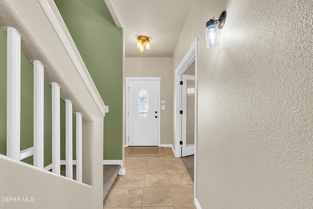 2937 Pino Triste Dr, El Paso, TX 79938 - entryway featuring light tile patterned flooring and a textured wall